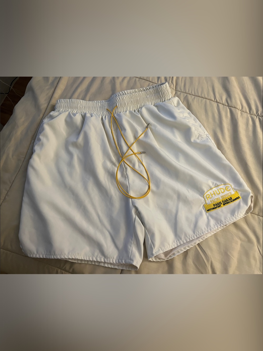 Rhude White Swim Shorts with Yellow Drawstring and Patch